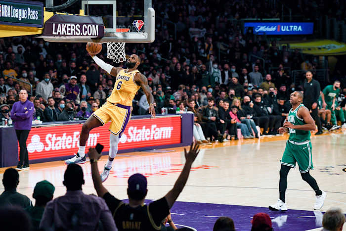 LeBron James jumps to dunk the ball